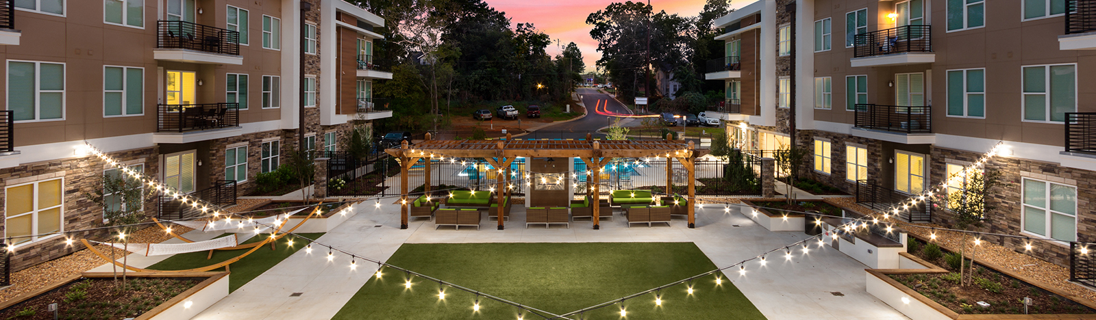 Outdoor resident lounge featuring a large open green space