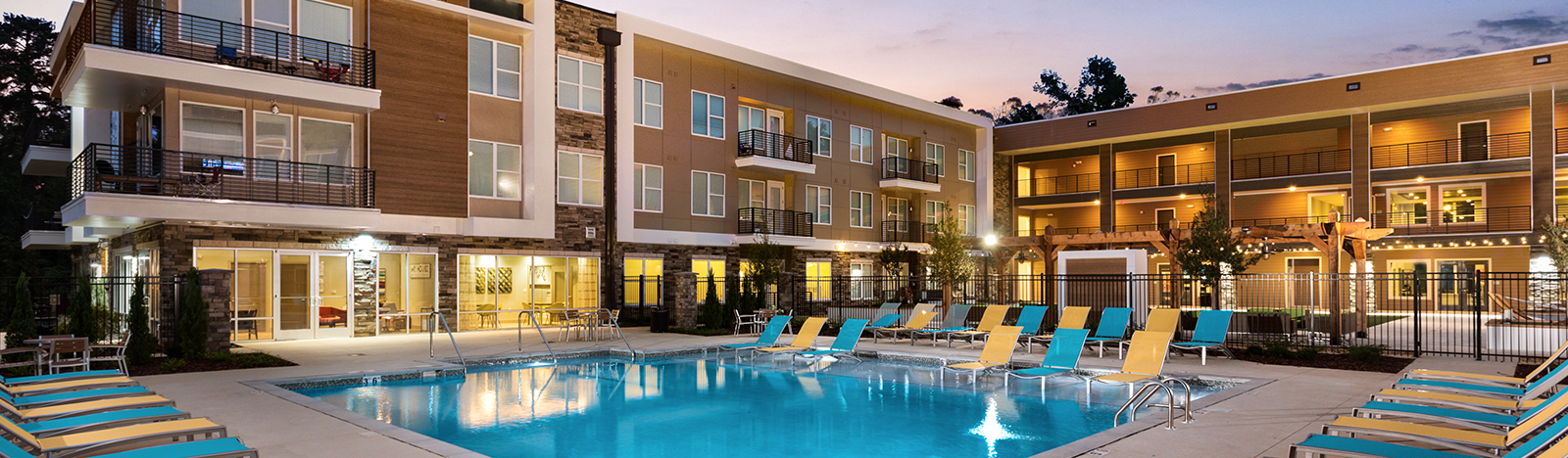 Resort style pool surrounded by lounge chairs