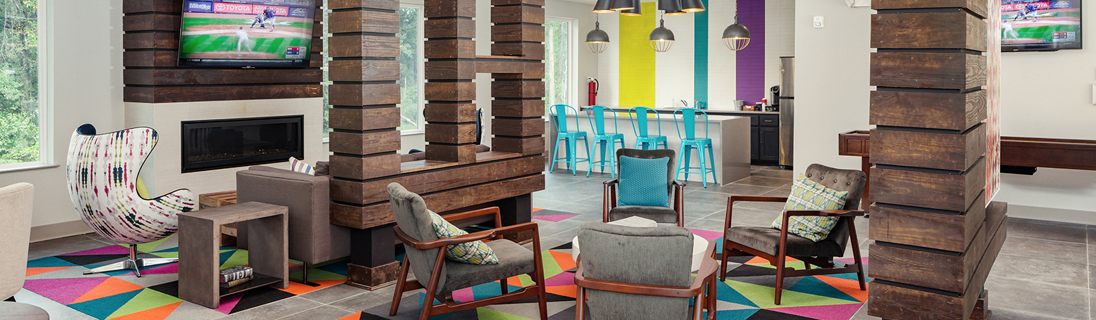 Resident lounge featuring an entertainment center and fire place