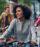 Young woman riding a bike in the city